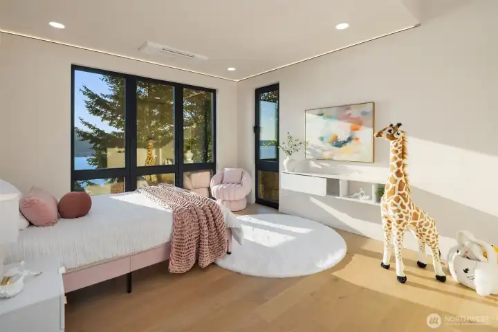 Versatile spaces – Light-filled bedroom easily adapts for family living.