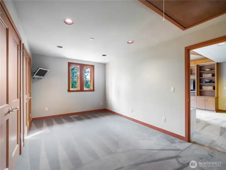 This flex room, which is off the second bedroom is lined with floor-to-ceiling closets could be ideal for a home gym, bonus room or dressing suite.