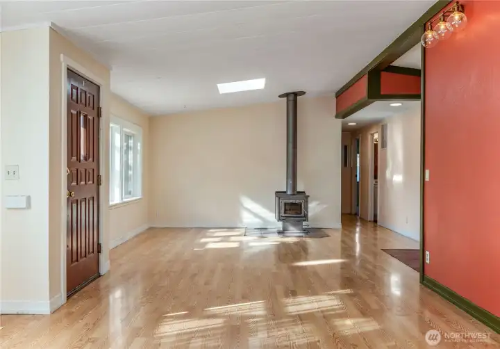 View past the front door and down the hall to the bedrooms.