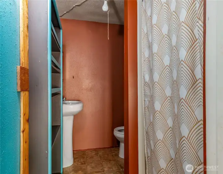 3/4 bath in unfinished workshop space.