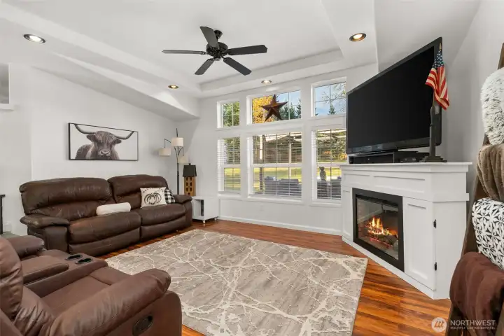 Family room with electric fireplace.