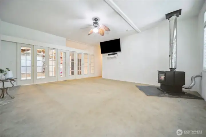 Living room with newer wood burning stove to keep you warmon those cold winter nights.