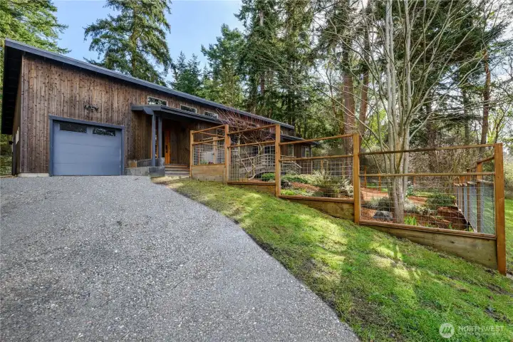 An inviting driveway finished with freshly laid gravel.