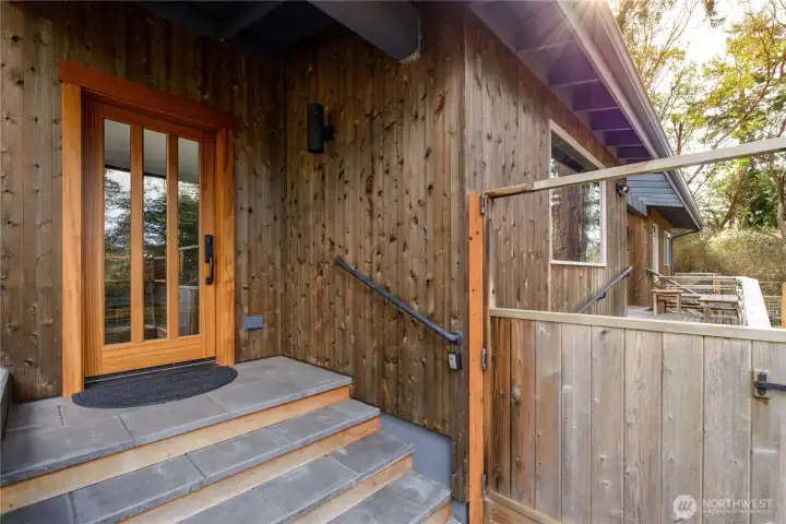 Terrace like entry, with beautifully trimmed door, custom hardware giving the feel of an authentic Genkan entryway.