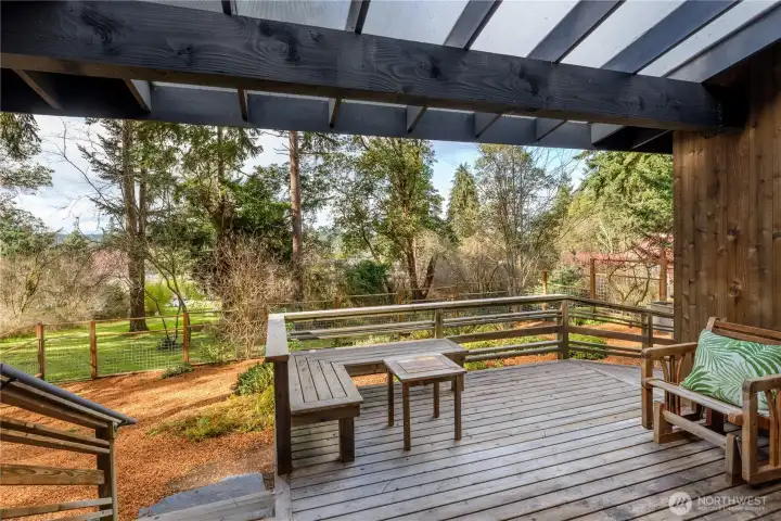 The front sun deck provides an inviting outdoor extension of the home, thoughtfully designed to capture sunlight and create a comfortable place to unwind throughout the day.