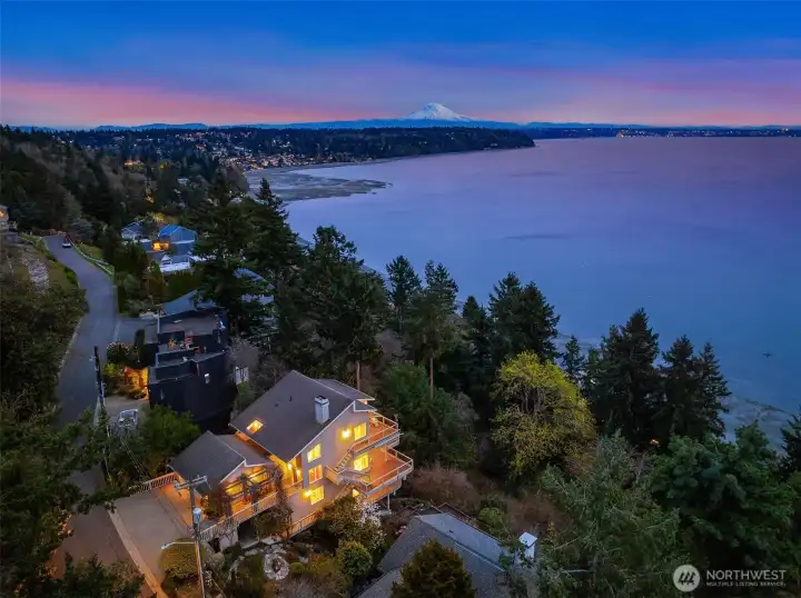 Welcome to Three Tree Point with this custom Northwest home overlooking a captivating kaleidoscope of vistas.