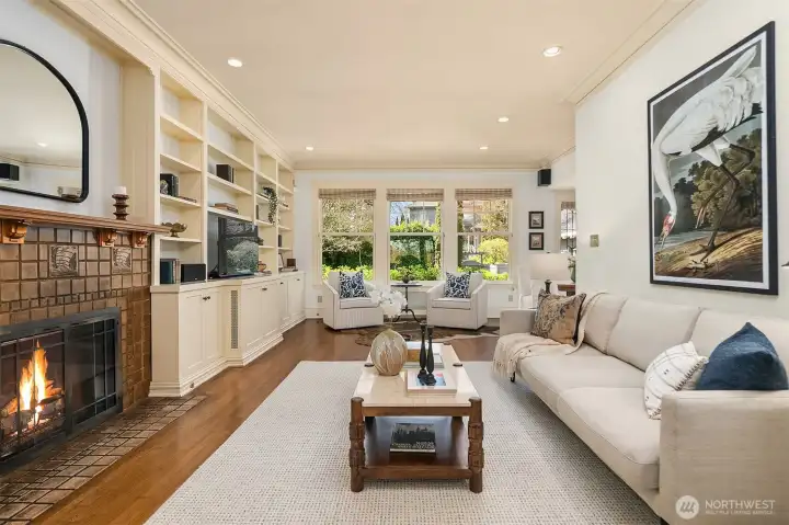 Great room overlooking the backyard has a wall of built-ins plus gas fireplace.