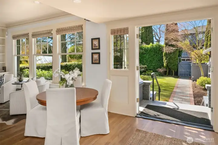 French doors open to expansive west-facing backyard.