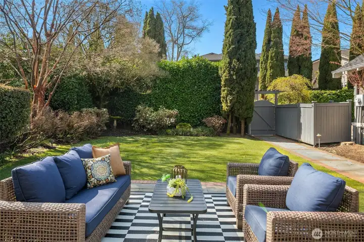 Sun-drenched level yard and stone patio, quiet and private. Sun-drenched level yard and stone patio, quiet and private.