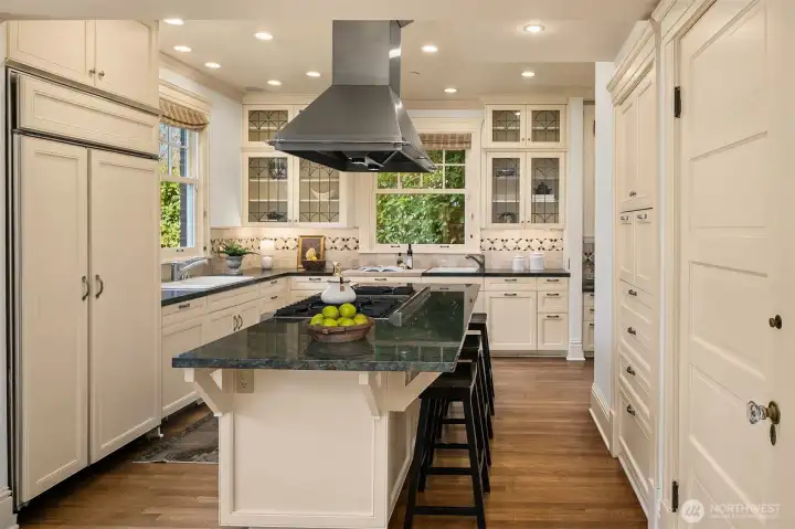 Lovely updated kitchen with a wealth of storage and eating island.