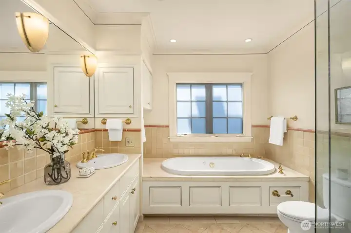 Ensuite bath with two closets, dressing hall, double sink vanity, soaking tub + separate shower. Ensuite bath with two closets, dressing hall, double sink vanity, soaking tub + separate shower.