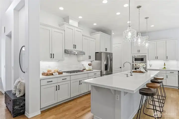 In 2024 the quartz counters, tile backsplash and beverage fridge were added. Enjoy under cabinet lighting and pull-out shelves.