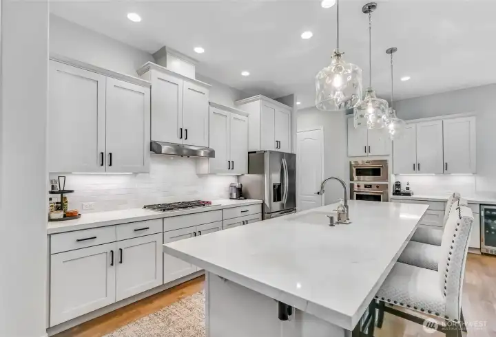 In 2024 the quartz counters, tile backsplash and beverage fridge were added. Enjoy under cabinet lighting and pull-out shelves.