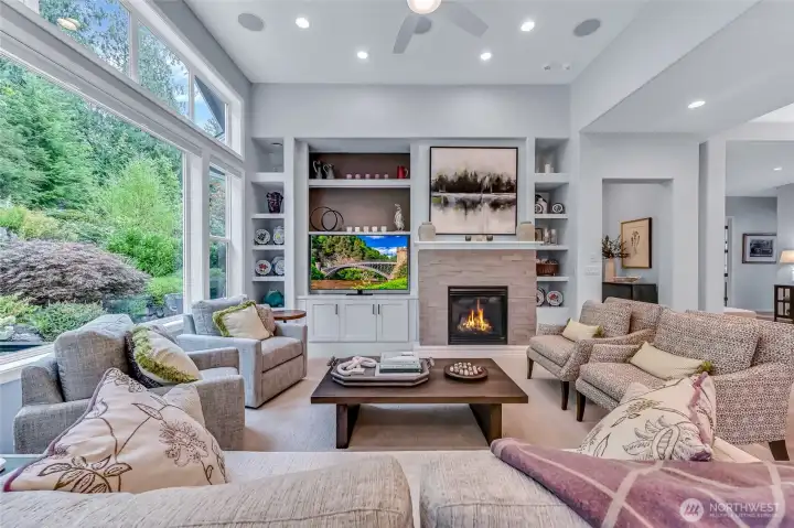 What a gathering place to watch a game or a movie while still enjoy the beauty of the backyard.