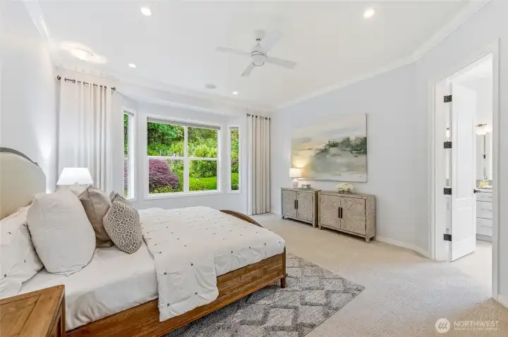 Enjoy the backyard views from the primary bedroom. The two walk-in closets have custom, Container Store, high end organizers.