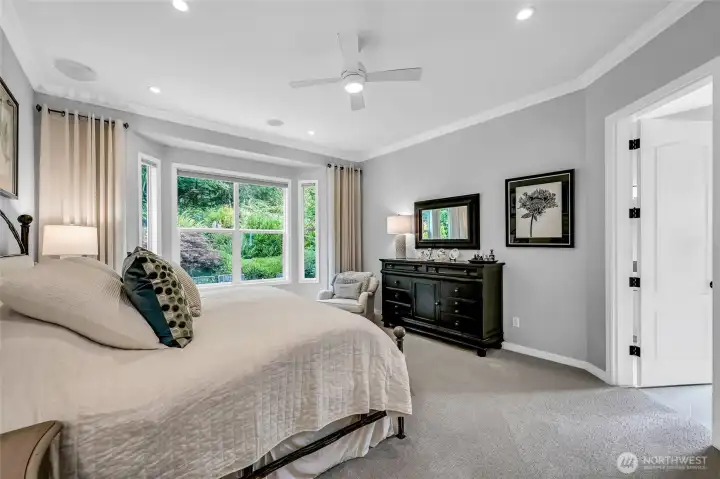 Enjoy the backyard views from the primary bedroom. The two walk-in closets have custom, Container Store, high end organizers.
