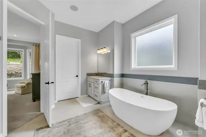 New flooring tile, Kohler undermount sinks, Hans Grohe faucets and a Toto toilet added in 2022.