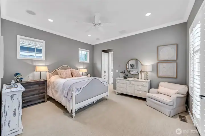 Guest retreat with French doors that open to the courtyard, plantation shutters and an-ensuite bath.