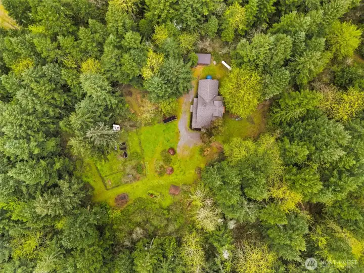 Large 5 acres with fenced gardens, individual well, updated solar power, wooded walking trails & hidden gems!