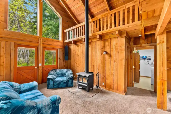 Double doors to covered wraparound veranda.