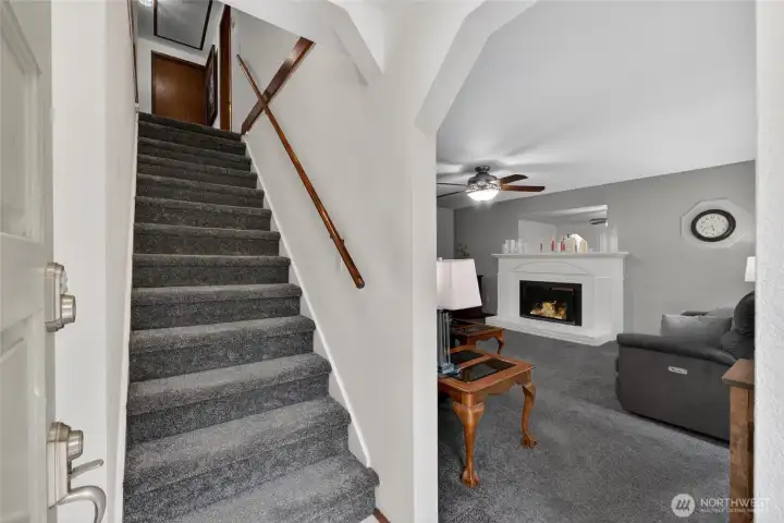 Entry opens up to a large living room and access to the upstairs