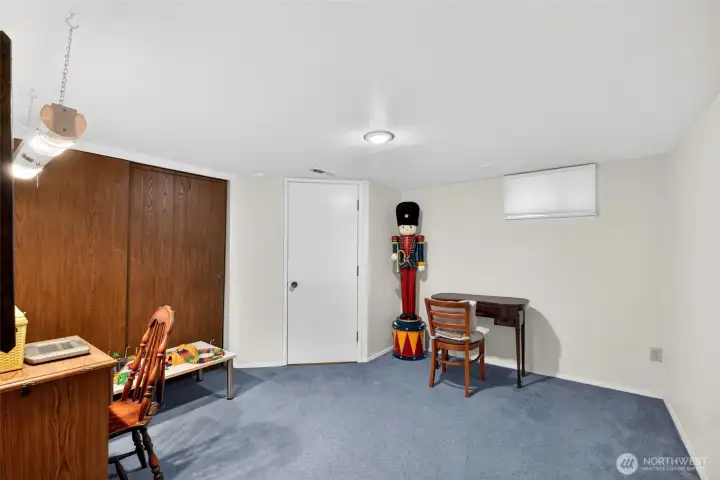 Office space, craft room, den, bedroom? on the lower level with access to the utility room