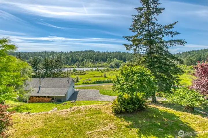 The neighbor sits at a lower elevation. The views change with the tide and the seasons,