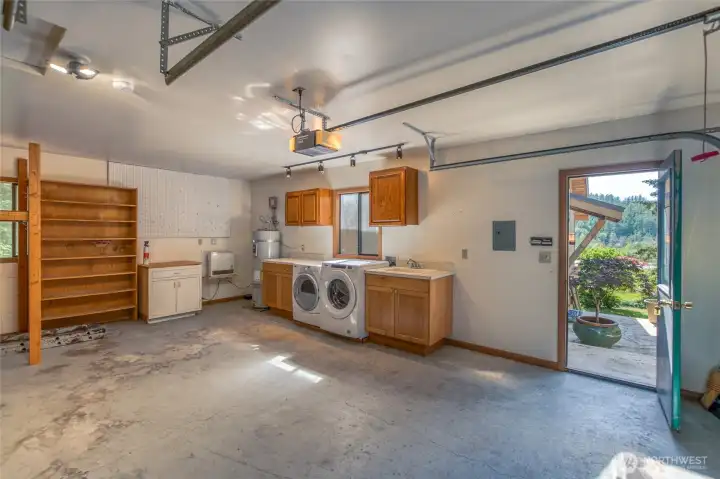 The garage is deep and allows for other uses. Washer/dryer, sink and hot water heater located in garage.