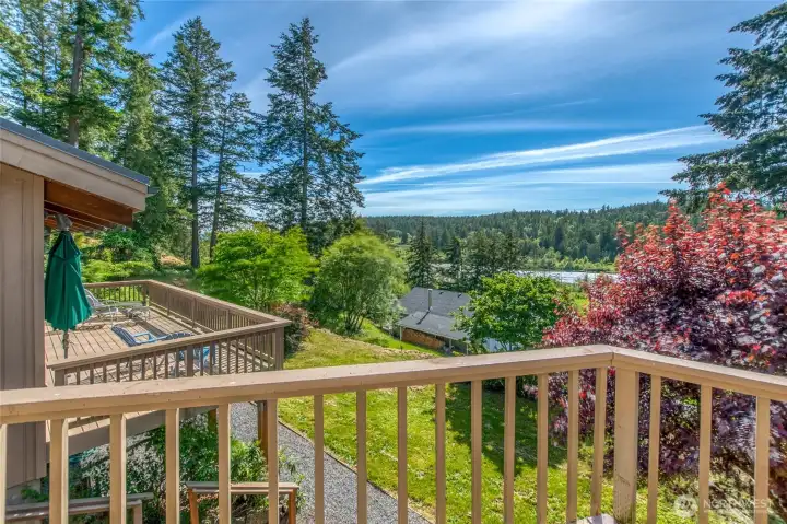 View from the main house deck looks out to the Cayou Quay Estuary. Studio deck shown here on the left.
