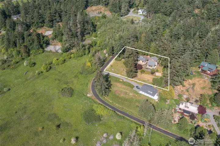 Hugged by fir tress, views to the west and protected open space on the west/north side of Cayou Valley Road.