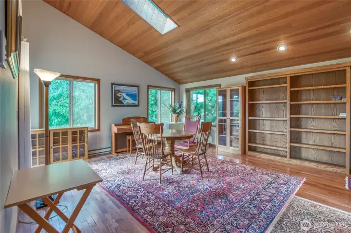 This is the great room at the front entrance of the main house. This space has access to the deck and built in book cases. Many options for use and modifying the space.