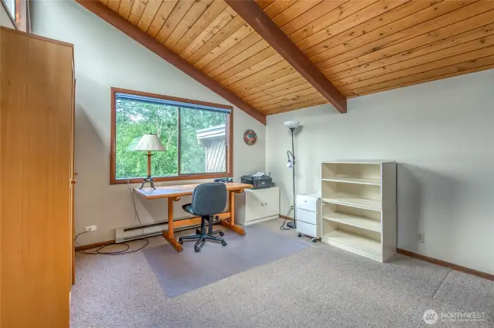 The second upper bedroom, vaulted ceiling and upper windows on the left.