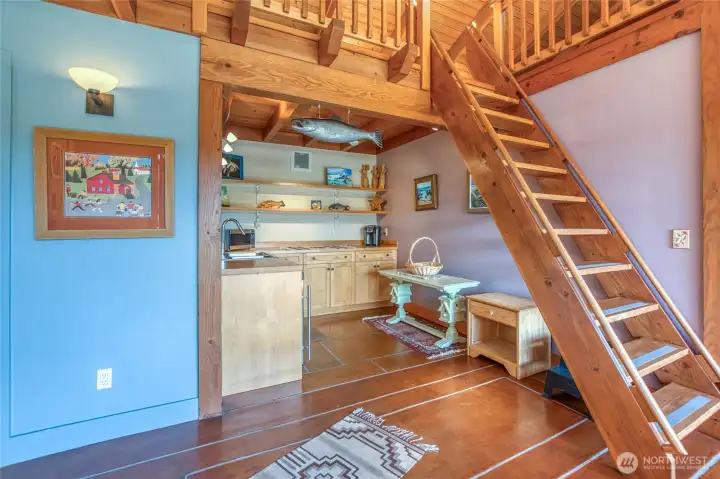 Kitchenette and stairway to upper loft in the studio.