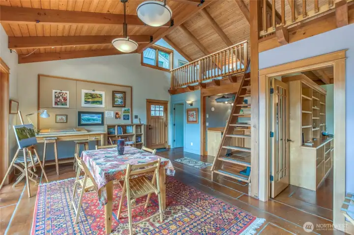 Plenty of light, vaulted ceiling, big windows, in-floor heating, open floor plan.