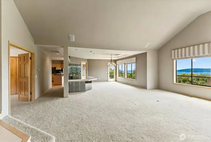 Spacious living and dining areas featuring large picture windows, abundant natural light, and sweeping views of the San Juan Islands and surrounding waterways.