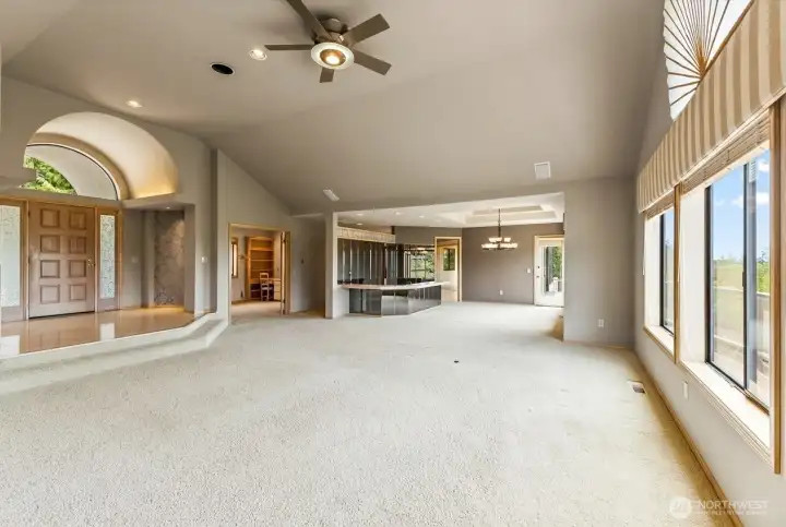 Spacious living areas offer endless possibilities for furniture layouts, gathering spaces, and entertaining, all enhanced by abundant natural light and views beyond.