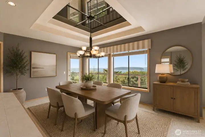 Virtually staged - Dedicated dining area with panoramic water and island views, located adjacent to the sunken wet bar and offering direct access to the view deck for enjoying the scenery and coastal breezes.