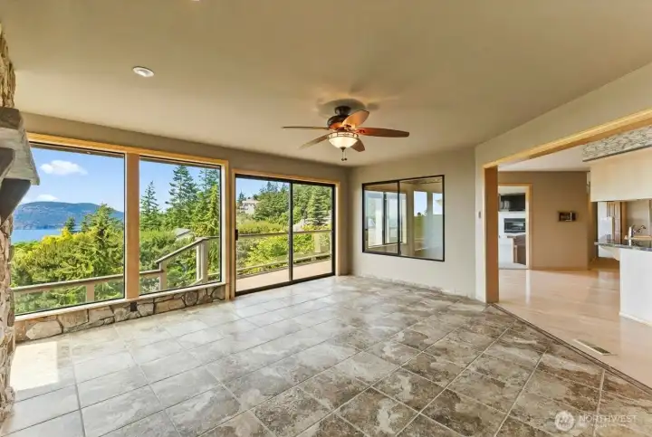 The family room adds valuable everyday living space, offering room to spread out while maintaining easy access to the kitchen, deck, and surrounding views.