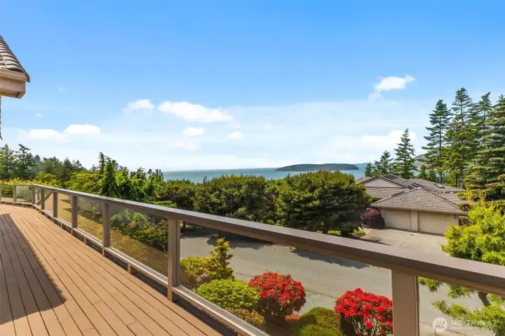 Wake up to water and island views from the primary suite, with direct access to the view deck and the ever-changing scenery beyond.