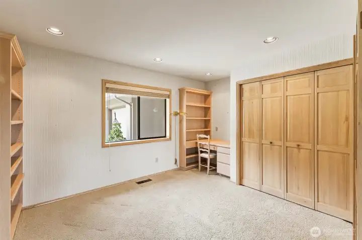 A dedicated office with built-in storage and workspace, offering the flexibility to serve as a guest room, hobby room, or third bedroom.