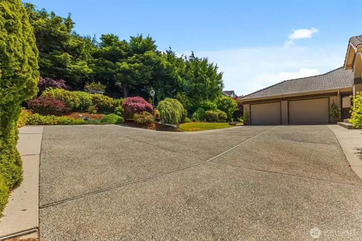 Large driveway offers abundant off-street parking and plenty of room to comfortably turn around rather than backing onto the street.