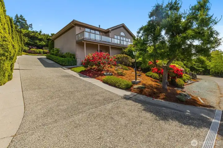 Beautifully landscaped grounds create a welcoming first impression, with mature plantings, seasonal color, and low-maintenance outdoor spaces.