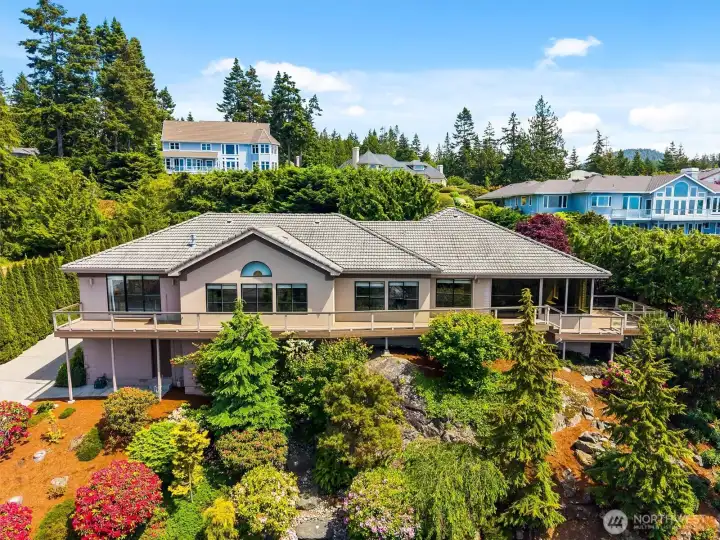 Set among beautifully landscaped grounds, this spacious one-level residence combines privacy, comfort, and unforgettable views, creating a setting that feels both peaceful and impressive.