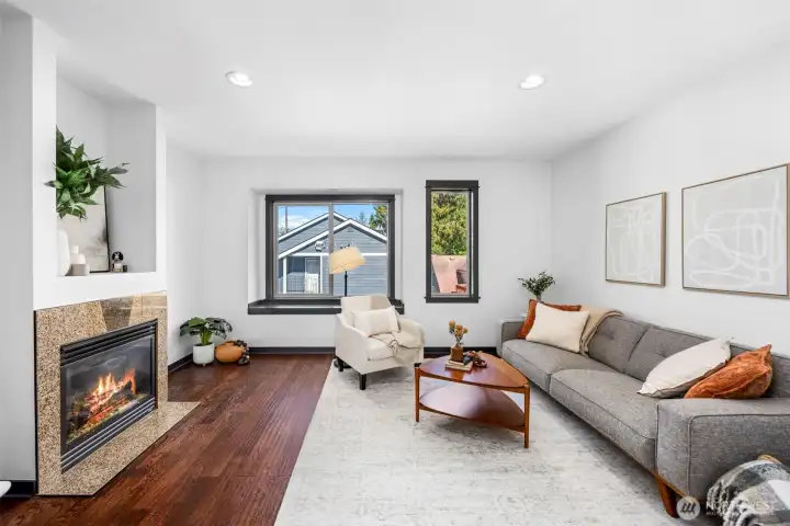 A cozy fireplace creates an inviting focal point in the main living space.