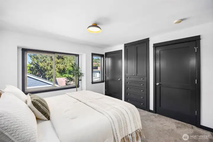 Built-in floor-to-ceiling wardrobes in the primary bedroom.