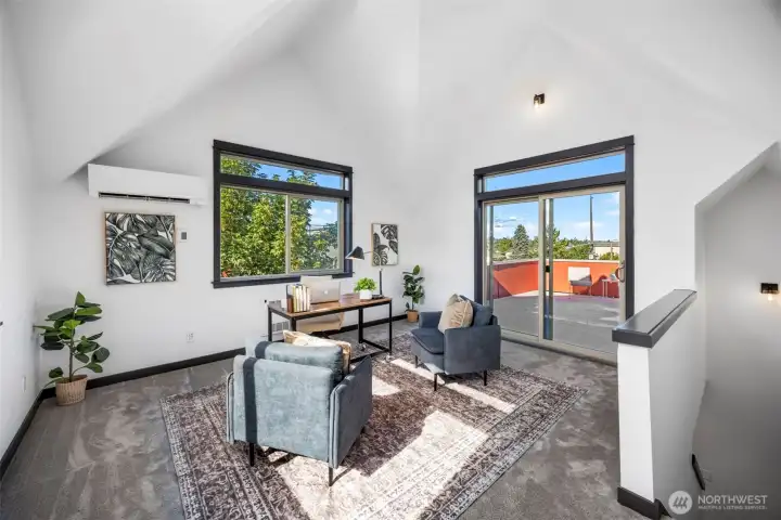 Dramatic vaulted ceilings amplify the natural light and draw you out toward the private terrace.