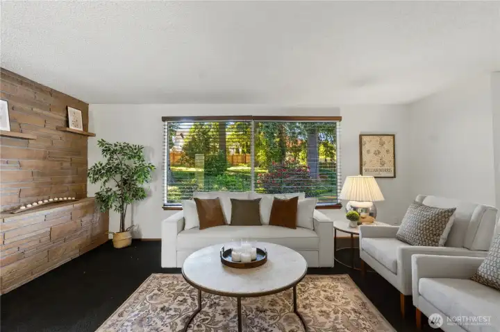 Expansive picture windows frame the natural beauty of the backyard while filling the home with abundant natural light. Expansive picture windows frame the natural beauty of the backyard while filling the home with abundant natural light.