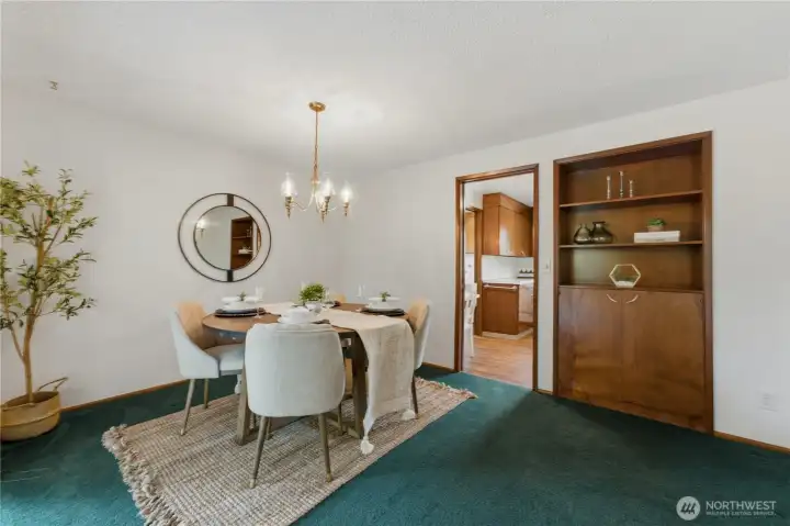 The dining room features an eye-catching built-in cabinet, offering additional storage and a touch of vintage charm. The dining room features an eye-catching built-in cabinet, offering additional storage and a touch of vintage charm.