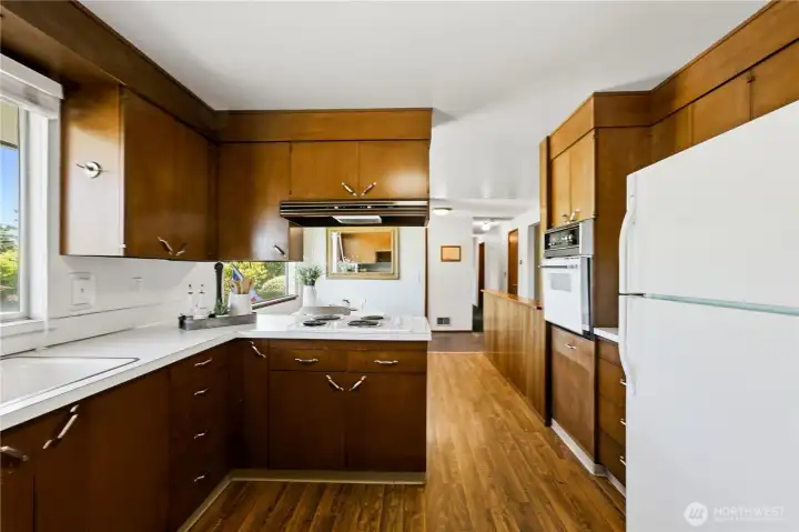 Step into the well-preserved kitchen with its classic mid-century character, featuring original cabinetry crafted with a level of quality rarely found today. Step into the well-preserved kitchen with its classic mid-century character, featuring original cabinetry crafted with a level of quality rarely found today.