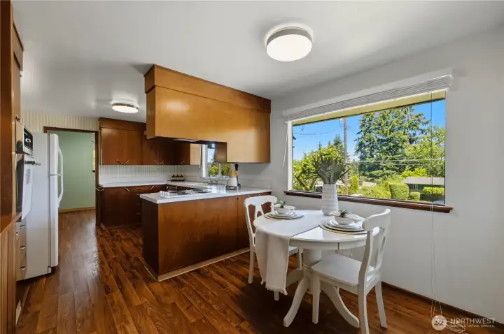 The kitchen also boasts a casual eating nook with a large picture window that overlooks the front yard. The kitchen also boasts a casual eating nook with a large picture window that overlooks the front yard.